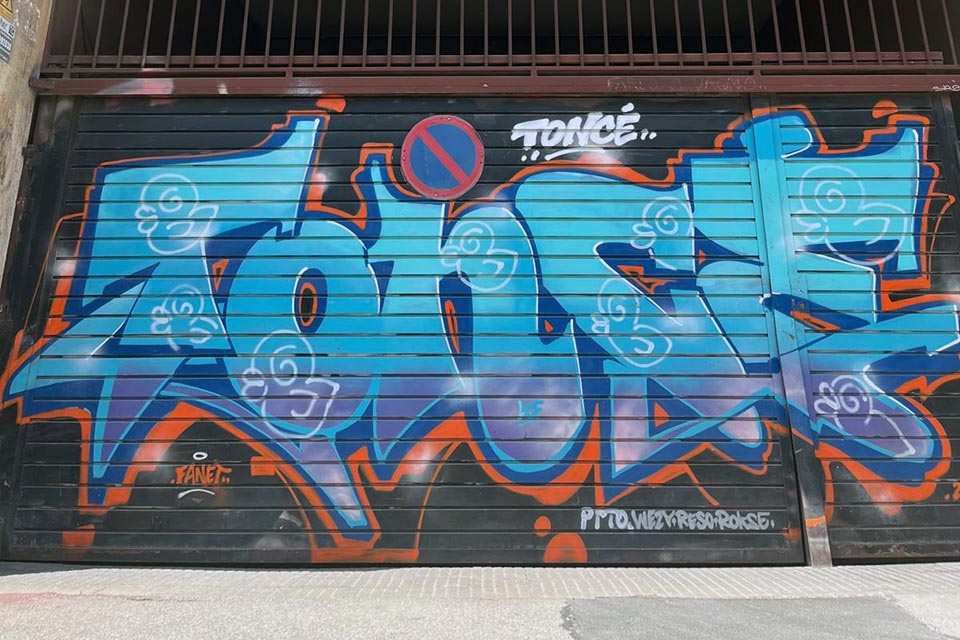 graffiti artwork on a metal shutter